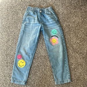 Girls H&M smiley face pants. Size 7